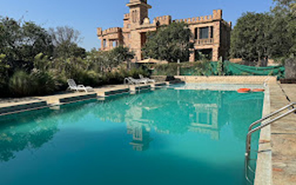 Swimming pool and heritage-style stay at Gir Lion Resort near Gir National Park Gujarat