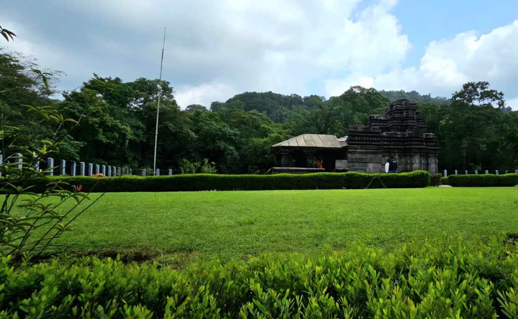 Historic Tambdi Surla Temple surrounded by lush green forest during Goa Herping Monsoon Trail experience