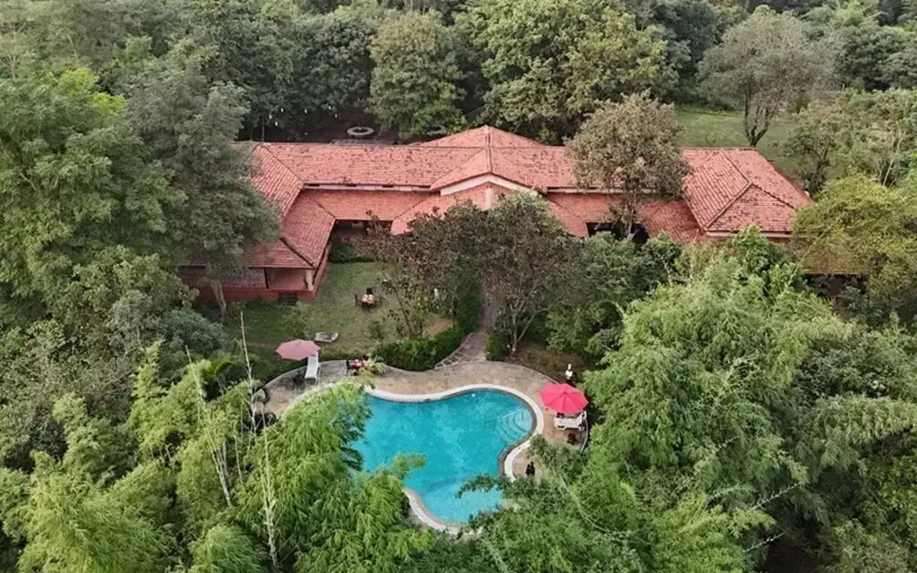 Infinity Resorts Kanha surrounded by forest with swimming pool